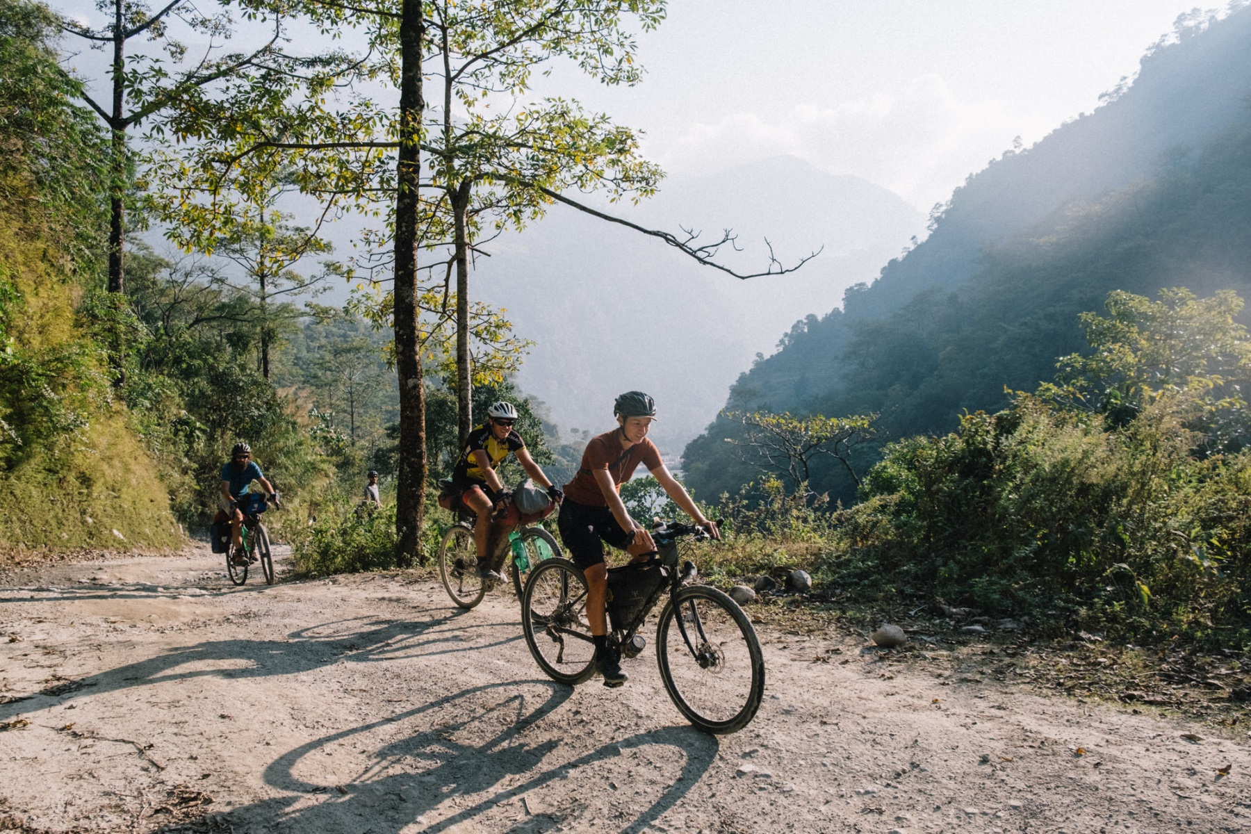Sabina cycling uphill in the Nepali Himalayan mountains