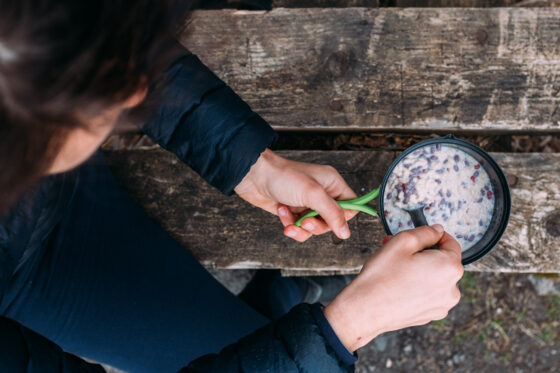 Sabina is cooking the ultimate breakfast while bikepacking: oatmeal