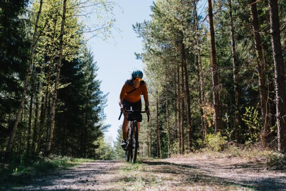 Sabina Knezevic from Farawayistan gravel cycling on a gravel road in Dalsland