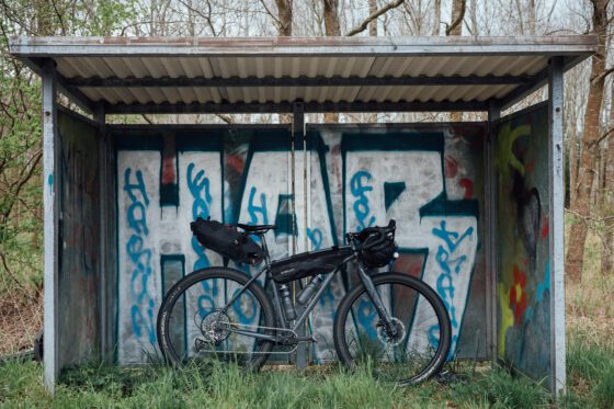 Bike loaded with bikepacking bags on a gravel road in Skåne, Sweden