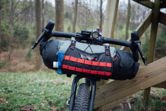 Bike loaded with bikepacking handlebar bag on a gravel road in Skåne, Sweden