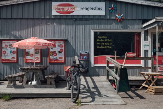 Gravel bike parked outside a rural Swedish supermarket during a cycling break