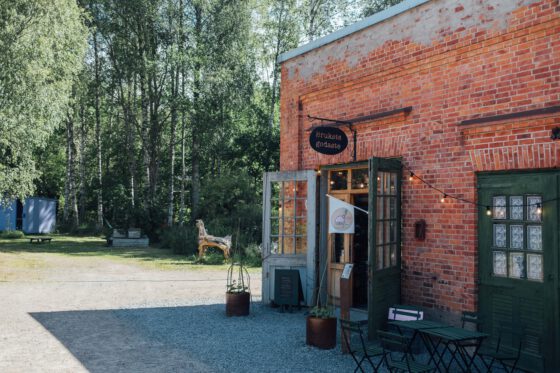 Exterior of Brukets Godaste bakery in Dalsland, Sweden — cozy red building in a historic setting