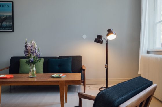 Minimalist guest room at Nordic Refuge with clean design and forest views in Dalsland, Sweden