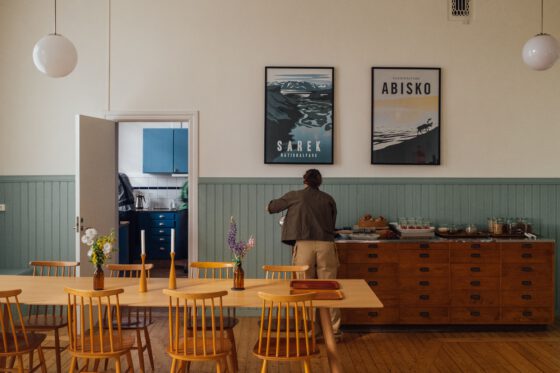 Nordic Refuge breakfast hall with wooden details and large windows looking out onto nature